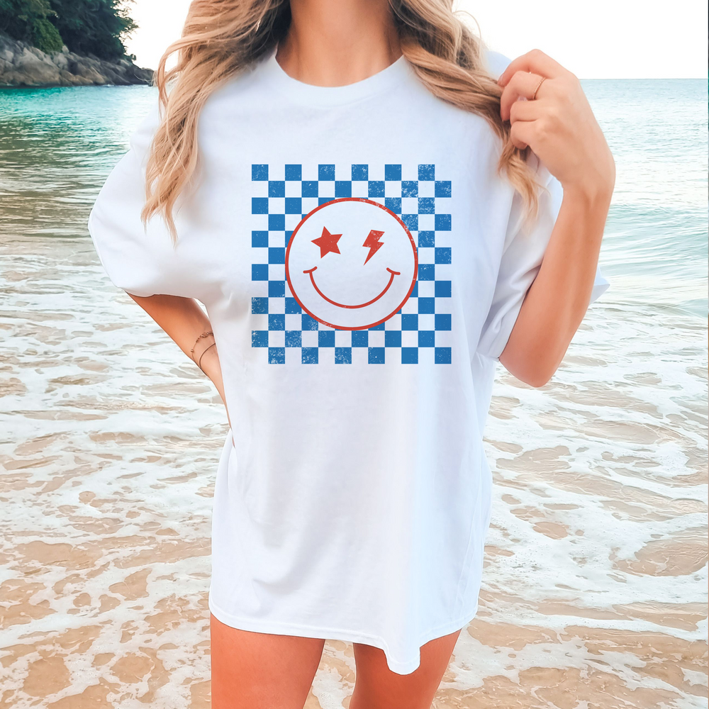 This Checkered Distressed Smiley Unisex Tee ain't your ordinary t-shirt! Shake up your wardrobe with this super cool, retro-checkered design featuring a hip hop style smiley face. Whether you're layering away or keeping it casual, this comfy tee is the perfect way to make a statement without saying a word!
