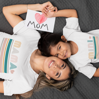 Load image into Gallery viewer, Introducing our delightful Momma and Me T-Shirt Set, a perfect way to showcase the bond between a mother and her child! Crafted with love and care, this adorable matching set is designed to celebrate the special connection shared by moms and their little ones.

